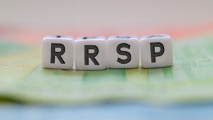 rrsp letters on white blocks with bills on a clear background